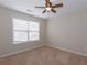 Well-lit bedroom featuring neutral walls, carpet, and ceiling fan at 3637 Kelsey Chase Ct, Marietta, GA 30060