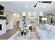 Spacious living room with a white couch and built-in shelving at 5215 Maggie Mae Ln, Cumming, GA 30028