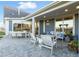 Outdoor patio area with seating and dining furniture at 5215 Maggie Mae Ln, Cumming, GA 30028