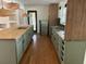 Modern kitchen with green cabinets and butcher block island at 2381 County Line Sw Rd, Atlanta, GA 30331