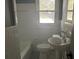 Updated bathroom with pedestal sink, tub and shower at 2381 County Line Sw Rd, Atlanta, GA 30331