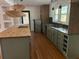 Modern kitchen with green cabinets and butcher block island at 2381 County Line Sw Rd, Atlanta, GA 30331