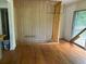 Bright dining room with hardwood floors and wood wall accents at 2381 County Line Sw Rd, Atlanta, GA 30331