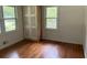 Well-lit bedroom with hardwood floors and built in closet at 2381 County Line Sw Rd, Atlanta, GA 30331