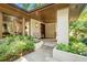 Inviting front porch with stone flooring, bench, and lush landscaping at 1068 Wildwood Ne Rd, Atlanta, GA 30306