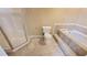 Bathroom with shower, toilet, and built-in tub at 4169 Panola Lake Cir, Lithonia, GA 30038