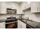 Well-equipped kitchen featuring stainless steel appliances and granite counters at 2479 Peachtree Ne Rd # 304, Atlanta, GA 30305