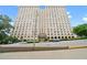 Tall apartment building with many windows and a parking area at 2479 Peachtree Ne Rd # 304, Atlanta, GA 30305
