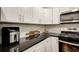 Stylish kitchen with white cabinets, granite countertops, and stainless steel appliances at 2479 Peachtree Ne Rd # 304, Atlanta, GA 30305