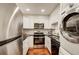 Modern kitchen with stainless steel appliances and white cabinets at 2479 Peachtree Ne Rd # 304, Atlanta, GA 30305