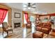 Spacious living room with hardwood floors, fireplace, and leather furniture at 738 Key Largo Ct, Auburn, GA 30011