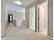 Upstairs hallway with carpet, doors to bedrooms and bathroom at 738 Key Largo Ct, Auburn, GA 30011