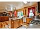 Open floor plan showing kitchen, living room with hardwood floors, and fireplace at 738 Key Largo Ct, Auburn, GA 30011