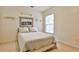 Bright bedroom with neutral walls, carpeted floors, and built-in shelves at 738 Key Largo Ct, Auburn, GA 30011