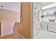 Laundry room with washer, dryer, and shelving for storage at 738 Key Largo Ct, Auburn, GA 30011