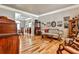 Living room with hardwood floors, antique furniture, and large windows at 738 Key Largo Ct, Auburn, GA 30011
