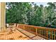 Deck with wooded views and seating area for outdoor relaxation at 738 Key Largo Ct, Auburn, GA 30011