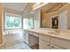 Bathroom with double vanity, bathtub, and walk-in shower at 738 Key Largo Ct, Auburn, GA 30011