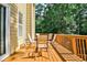 Deck with wooded views and seating area for outdoor relaxation at 738 Key Largo Ct, Auburn, GA 30011