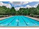 Community lap pool with plenty of lounge chairs at 738 Key Largo Ct, Auburn, GA 30011