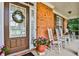 Inviting front porch with rocking chairs and potted plants at 738 Key Largo Ct, Auburn, GA 30011