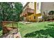 Landscaped backyard with tiered deck and lush greenery at 738 Key Largo Ct, Auburn, GA 30011
