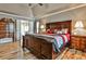 Main bedroom with king-size bed and ensuite bathroom access at 738 Key Largo Ct, Auburn, GA 30011