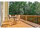 Deck with wooded views and seating area for outdoor relaxation at 738 Key Largo Ct, Auburn, GA 30011