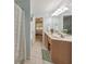 Main bathroom with double vanity, garden tub, and access to bedroom and closet at 388 Oakhaven Way, Villa Rica, GA 30180