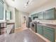 Kitchen with green cabinets, stainless steel appliances, and granite countertops at 388 Oakhaven Way, Villa Rica, GA 30180