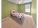Small bedroom with green walls and carpeted floor at 388 Oakhaven Way, Villa Rica, GA 30180