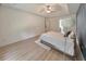 Main bedroom with wood-look flooring and access to en-suite bathroom at 388 Oakhaven Way, Villa Rica, GA 30180