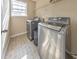 Laundry room with washer, dryer, and shelving at 388 Oakhaven Way, Villa Rica, GA 30180