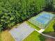 Aerial view of a tennis court and basketball court at 388 Oakhaven Way, Villa Rica, GA 30180