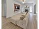 Relaxing living room featuring a sectional sofa and built in entertainment center at 388 Oakhaven Way, Villa Rica, GA 30180