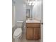 Clean bathroom with wood vanity and updated toilet at 388 Oakhaven Way, Villa Rica, GA 30180