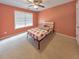Charming bedroom with a window and ceiling fan at 388 Oakhaven Way, Villa Rica, GA 30180