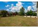 Large backyard with grassy area and some trees at 2413 Mcintosh Dr, Locust Grove, GA 30248