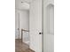 Spacious hallway with hardwood floors, a staircase, and built-in shelving at 100 Ottley Ln, Atlanta, GA 30305