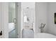 Bright bathroom with a glass shower, double sinks, and a view of the bedroom at 100 Ottley Ln, Atlanta, GA 30305