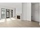 Bright and airy living room with hardwood floors and a fireplace at 100 Ottley Ln, Atlanta, GA 30305
