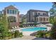 Community pool with lounge chairs and umbrellas at 100 Ottley Ln, Atlanta, GA 30305
