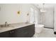 Luxurious bathroom with dark cabinetry, marble floors, and a soaking tub at 100 Ottley Ln, Atlanta, GA 30305