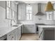 Modern kitchen with white cabinetry, marble countertops, and high-end appliances at 100 Ottley Ln, Atlanta, GA 30305