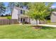 Two-story house with brick and siding, two-car garage, and landscaped lawn at 1018 Nandina Ct, Villa Rica, GA 30180