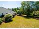 Large backyard with mature trees and fence at 1001 S Creek Dr, Villa Rica, GA 30180