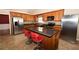 Island kitchen with stainless steel appliances and granite countertops at 1001 S Creek Dr, Villa Rica, GA 30180