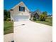 One-story house with a two-car garage and landscaped yard at 1001 S Creek Dr, Villa Rica, GA 30180