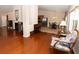 Hardwood floors and a cozy sitting area are featured in this spacious living room at 1001 S Creek Dr, Villa Rica, GA 30180