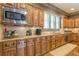 Spacious kitchen with granite countertops, stainless steel appliances, and ample wood cabinetry at 1829 Buckhead Valley Ne Ln, Atlanta, GA 30324
